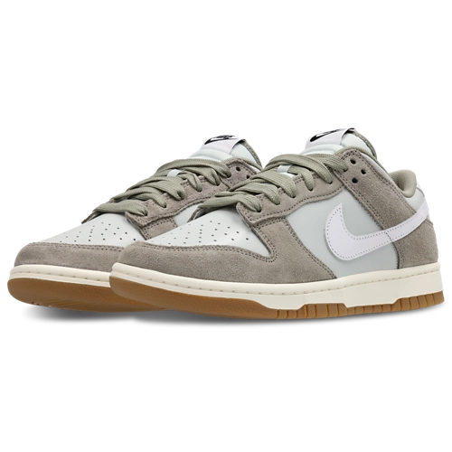 Gray and white sneakers with a brown sole on a white background